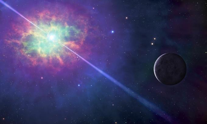 Imagine a spațiului, cu un nor colorat în jurul unei stele care proiectează fascicule de lumină în două direcții, cu o planetă luminată în apropiere.