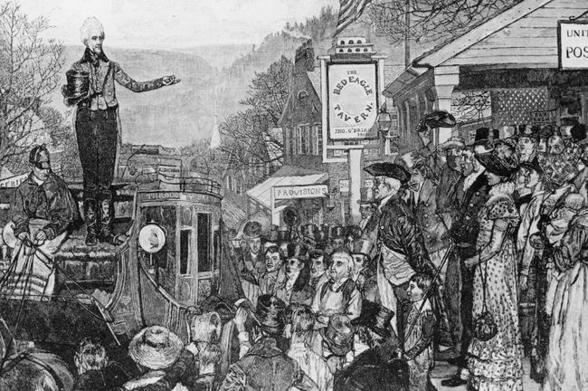 Andrew Jackson, stând pe un autocar, făcând semn cu mâna susținătorilor, în drum spre Washington pentru a deveni al șaptelea președinte al Statelor Unite în 1829.